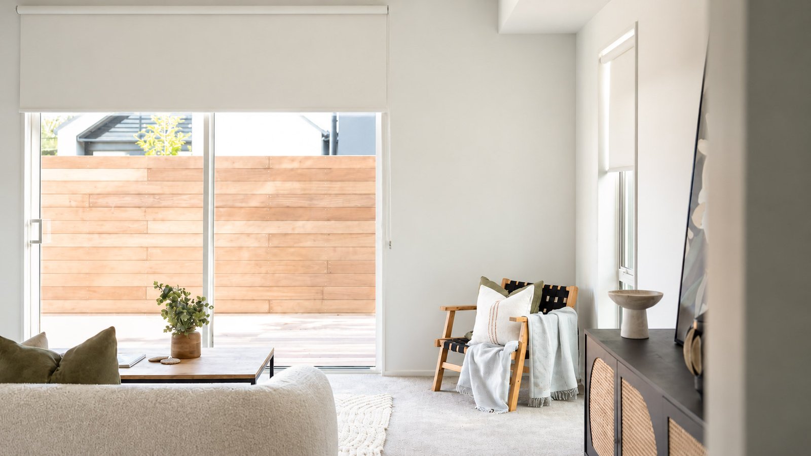 Blockout roller blinds on sliding doors in a Halswell home